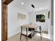 Bright dining area featuring modern lighting and a wooden table with seating at 1517 S Elkhart St, Aurora, CO 80012
