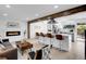 Open concept living room featuring a fireplace and connection to the kitchen at 1517 S Elkhart St, Aurora, CO 80012