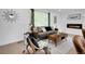 Stylish living room with a modern fireplace and comfortable seating area at 1517 S Elkhart St, Aurora, CO 80012