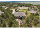 Expansive property nestled amongst mature trees, featuring a rear deck and lush natural surroundings at 20413 Bald Mountain Ct, Monument, CO 80132