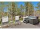 Backyard patio area with hot tub and seating offers space for outdoor relaxation at 20413 Bald Mountain Ct, Monument, CO 80132