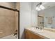 Well-lit bathroom features a shower/tub, a modern vanity, and warm beige tones at 20413 Bald Mountain Ct, Monument, CO 80132