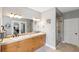 Bathroom with double sinks, a large vanity, and a glass-enclosed shower at 20413 Bald Mountain Ct, Monument, CO 80132