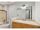 Neutral bathroom featuring tile shower/tub combo and a light wood vanity with a white sink and framed mirror at 20413 Bald Mountain Ct, Monument, CO 80132