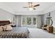 Main bedroom with backyard view and large windows filling the space with natural light at 20413 Bald Mountain Ct, Monument, CO 80132