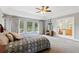 Bedroom featuring backyard views, a vanity, and an ensuite bathroom at 20413 Bald Mountain Ct, Monument, CO 80132