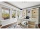 Bright home office features large windows, natural light, built-in shelving, and modern decor at 20413 Bald Mountain Ct, Monument, CO 80132