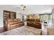 Open-concept living room flowing into the kitchen and dining areas with recessed lighting at 20413 Bald Mountain Ct, Monument, CO 80132