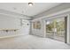 Neutral-toned room with view to the property; sliding doors open to patio at 20413 Bald Mountain Ct, Monument, CO 80132