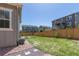 Fenced backyard offers a lush lawn, landscaping, and ample space for outdoor activities at 434 W 128Th Dr, Westminster, CO 80234