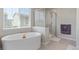 Elegant bathroom showcasing a freestanding tub and separate glass-enclosed shower at 434 W 128Th Dr, Westminster, CO 80234