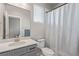 Bright bathroom features a stylish vanity, mirror, and tub with a shower curtain at 434 W 128Th Dr, Westminster, CO 80234