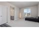 Open bedroom with an adjacent ensuite and ample natural light at 434 W 128Th Dr, Westminster, CO 80234