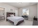 Comfortable bedroom features neutral walls, desk, and a door leading to the bathroom at 434 W 128Th Dr, Westminster, CO 80234