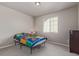 Bright bedroom with large window, neutral colors, and playful bedding at 434 W 128Th Dr, Westminster, CO 80234