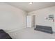Large bedroom, with space for a futon, that has neutral paint and light-colored carpet at 434 W 128Th Dr, Westminster, CO 80234