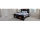 Cozy bedroom with natural light, plush carpet, and a decorative headboard at 434 W 128Th Dr, Westminster, CO 80234