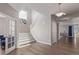 Bright entryway featuring hardwood floors, a staircase, and an open view into the spacious living area at 434 W 128Th Dr, Westminster, CO 80234