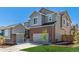 A beautiful two-story home showcases a brick facade and a two-car garage with an inviting curb appeal at 434 W 128Th Dr, Westminster, CO 80234