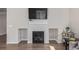 Modern fireplace with tiled surround and built-in storage at 434 W 128Th Dr, Westminster, CO 80234