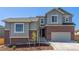 Beautiful home featuring brick accents, neutral siding, a two-car garage, and meticulous landscaping at 434 W 128Th Dr, Westminster, CO 80234