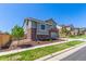 Attractive two-story home showcasing neutral siding, brick accents, landscaping, and an attached two-car garage at 434 W 128Th Dr, Westminster, CO 80234
