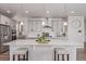 A kitchen featuring gray cabinets, stainless steel appliances, a large island, and pendant lighting at 434 W 128Th Dr, Westminster, CO 80234