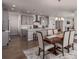 Open-concept kitchen features gray cabinets, stainless steel appliances, and a large island with bar seating at 434 W 128Th Dr, Westminster, CO 80234