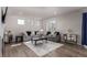 Inviting living room with a fireplace, wood floors, and stylish decor at 434 W 128Th Dr, Westminster, CO 80234