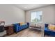 Bright living room features luxury vinyl plank flooring, a couch, and large window at 434 W 128Th Dr, Westminster, CO 80234