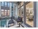 Cozy balcony with sleek furniture offers city views and access to the home's interior at 7600 Landmark Way # 1514, Greenwood Village, CO 80111