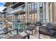 Relax on this spacious balcony with glass railings and comfortable seating, offering stunning views of the surrounding area at 7600 Landmark Way # 1514, Greenwood Village, CO 80111