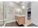 Bright bathroom features a floating vanity, large mirror, and modern fixtures near an open doorway at 7600 Landmark Way # 1514, Greenwood Village, CO 80111
