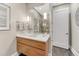 Well-lit bathroom showcasing floating vanity, large mirror, and modern fixtures at 7600 Landmark Way # 1514, Greenwood Village, CO 80111