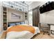 Cozy bedroom featuring custom shelving, a murphy bed, and natural light at 7600 Landmark Way # 1514, Greenwood Village, CO 80111