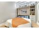 Bright bedroom features custom shelving and storage above bed, offering stylish functionality at 7600 Landmark Way # 1514, Greenwood Village, CO 80111