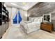 Charming bedroom with a wood accent wall, plush carpet, and large window for natural light at 7600 Landmark Way # 1514, Greenwood Village, CO 80111