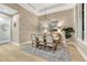 Neutral toned dining room with decorative lighting and large plant accents create an inviting ambiance at 7600 Landmark Way # 1514, Greenwood Village, CO 80111