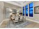 Elegant dining room with large windows, modern lighting, and stylish decor creates inviting atmosphere at 7600 Landmark Way # 1514, Greenwood Village, CO 80111