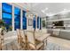 Open dining and living area features views from floor to ceiling windows and modern decor at 7600 Landmark Way # 1514, Greenwood Village, CO 80111