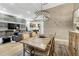 An open dining and living room area with modern fireplace and light neutral colors at 7600 Landmark Way # 1514, Greenwood Village, CO 80111