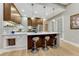 Kitchen island boasts bar seating, modern appliances, and ample counter space at 7600 Landmark Way # 1514, Greenwood Village, CO 80111