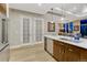 Open kitchen with an island, pendant lighting, stainless steel appliances and elegant design touches at 7600 Landmark Way # 1514, Greenwood Village, CO 80111