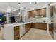 Bright kitchen with quartz countertops, stainless appliances, and stylish pendant lighting at 7600 Landmark Way # 1514, Greenwood Village, CO 80111