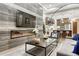 Open-concept living room featuring a modern fireplace, stainless steel appliances in view at 7600 Landmark Way # 1514, Greenwood Village, CO 80111