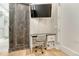 Dedicated office space featuring a desk and a barn door provides functionality with easy access at 7600 Landmark Way # 1514, Greenwood Village, CO 80111