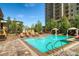 Take a refreshing dip in the inviting outdoor pool with lounge chairs, lush greenery, and resort-style amenities at 7600 Landmark Way # 1514, Greenwood Village, CO 80111