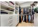 Spacious walk-in closet with custom shelving and storage solutions for optimal organization at 7600 Landmark Way # 1514, Greenwood Village, CO 80111