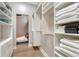 Spacious walk-in closet featuring custom built-in shelving and ample storage for clothes and accessories at 7600 Landmark Way # 1514, Greenwood Village, CO 80111