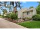Backyard featuring beautiful landscaping, a stone retaining wall, and lush greenery at 13781 E Marina Dr # A, Aurora, CO 80014